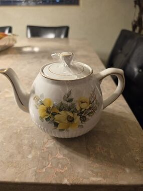 Classic White Ceramic Teapot with Yellow Floral Design